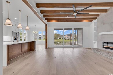 Unfurnished living room featuring light hardwood /