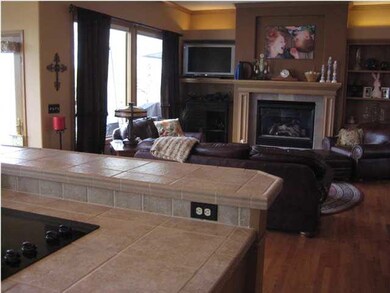 The kitchen open to the living area creates a hear