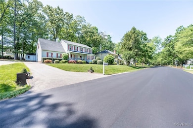 View of home, street and driveway