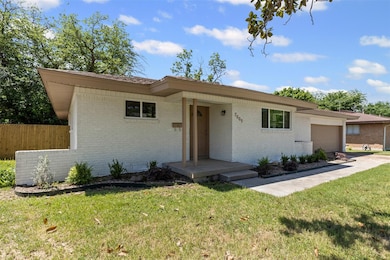 Ranch-style house featuring a front lawn, concrete