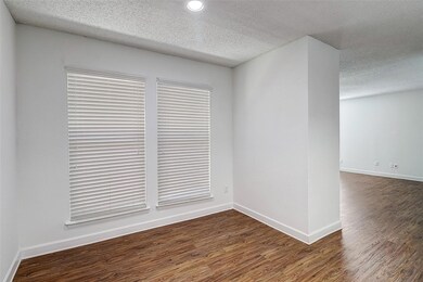 Empty room with dark hardwood / wood-style floors 