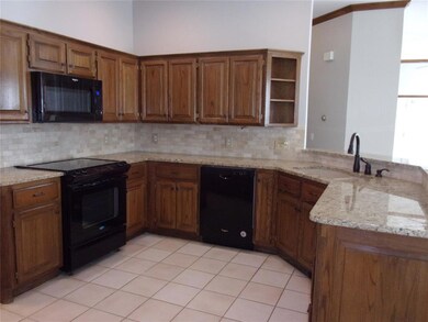 Kitchen featuring granite countertops, kitchen pen