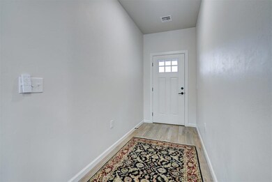 Nice entryway featuring light hardwood / wood-style tile plank flooring with 2 outlets.