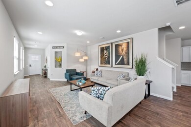 Living room featuring recessed lighting, dark woo