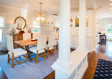 Foyer entry greeted by open dining