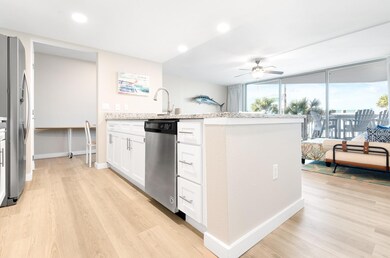Kitchen featuring stainless steel appliances, lig