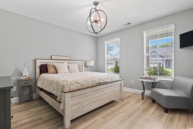 Bedroom with wood-type flooring and a notable chan