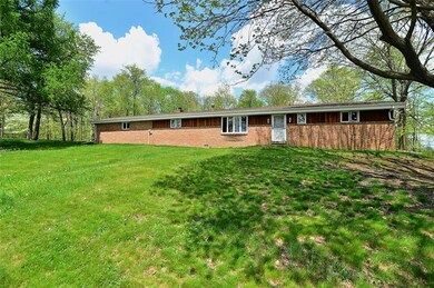 EXTERIOR FRONT - sturdy, brick veneer exterior wit