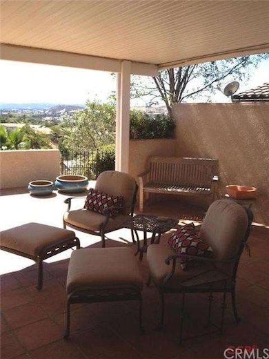 Covered patio with a terrific view and privacy wal