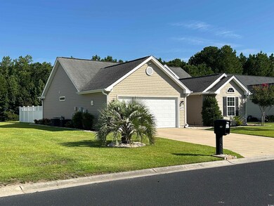 Single story home with a garage, concrete driveway, and roof with shingles