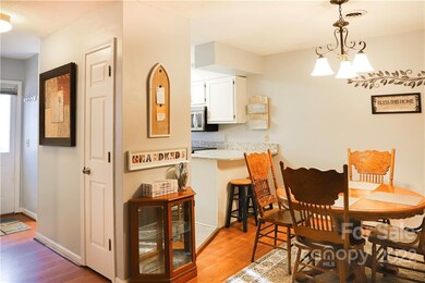 Front door to the left, looking into dining area