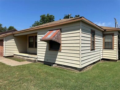 View of property exterior featuring a lawn