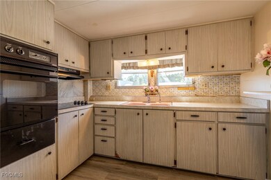 Kitchen with built-in wall oven and cooktop appliances