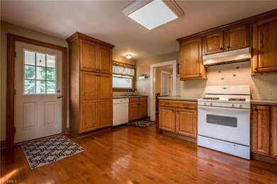 Oak cabinets and maple hardwood flooring