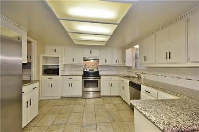KITCHEN WITH GRANITE COUNTERS, STAINLESS APPLIANCE