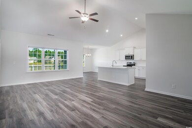 Unfurnished living room with dark wood-type floori