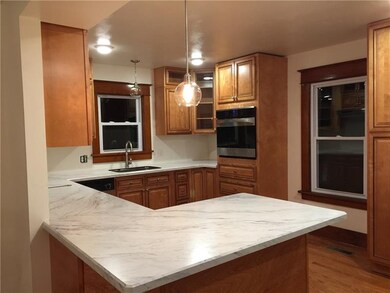 Updated kitchen with marble look countertops, new 