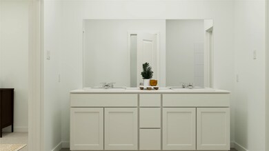 Full bath featuring double vanity and baseboards