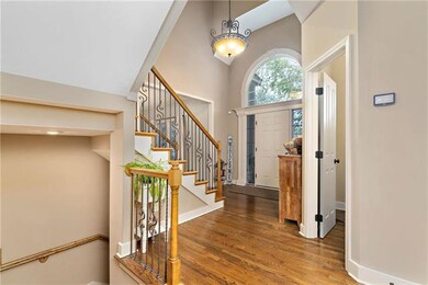 Half bath to the right and stairs leading to the b