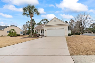View of front of house featuring a garage, drivewa