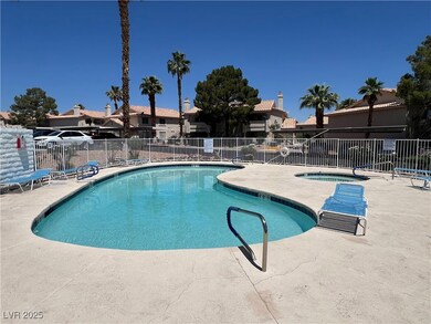 Community pool featuring a community hot tub and a