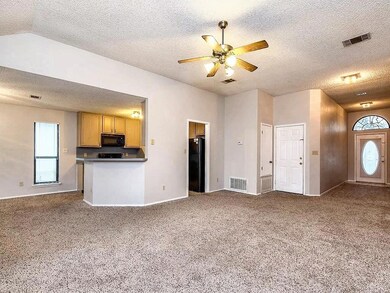 Unfurnished living room with a textured ceiling, 