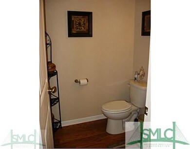 Bathroom. Downstairs Guest Half Bath also has Wood