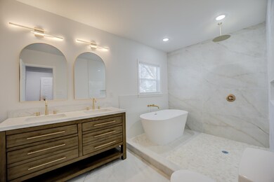 Bathroom featuring vanity and independent shower a