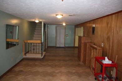 Note the open space with walkout to fenced backyard.