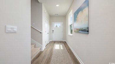 Doorway to outside featuring hardwood / wood-style flooring