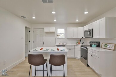 Kitchen with appliances with stainless steel finis