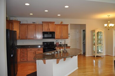 Large counter height bar-top! Great for entertaining! Appliances stay: Fridge, washer and dryer are included too!  Better than new... all you need is your furniture! 