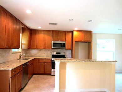 Kitchen has lot of Tall Custom Cabinets, Granite Counter Tops and New GE Appliances