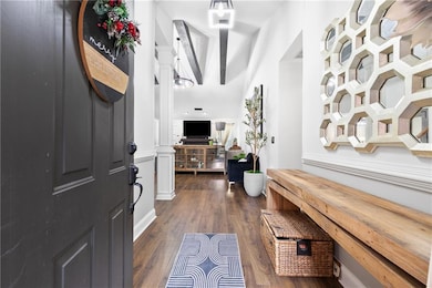 Entrance foyer featuring dark hardwood / wood-styl