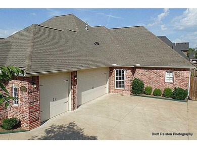 Exterior Back/Side. 3 car side entry garage with l
