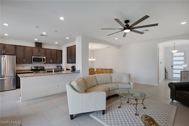 Living Room open floor plan. Tile flooring.