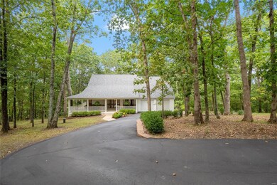 The asphalt driveway leads to this storybook home 