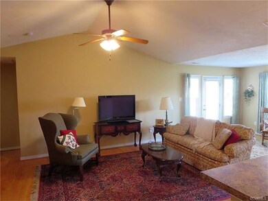 Great Room with vaulted ceilings and wood floors.