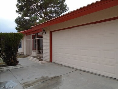 2 car garage and walk way to the gated courtyard