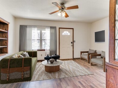 Entryway featuring ceiling fan and wood finished f