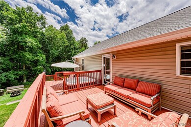 Expansive tiered deck overlooks private natural ar