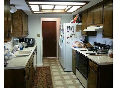 Kitchen. Galley type kitchen, door leads to garage