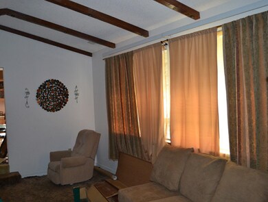 Living Room with open beam ceiling