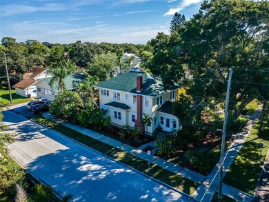 View of main home and garage with upstairs apartme