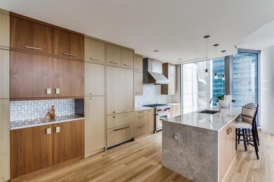 Updated cabinets, tile and waterfall island