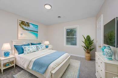 Bedroom featuring dark carpet