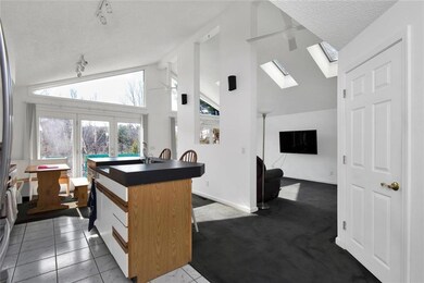 Kitchen opens to living room.