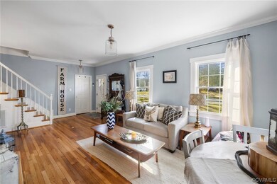 Living room featuring ornamental molding and light