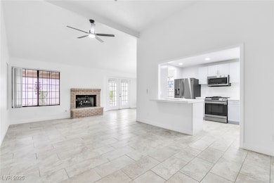 Unfurnished living room featuring beamed ceiling,