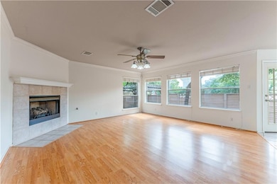Unfurnished living room featuring crown molding, 